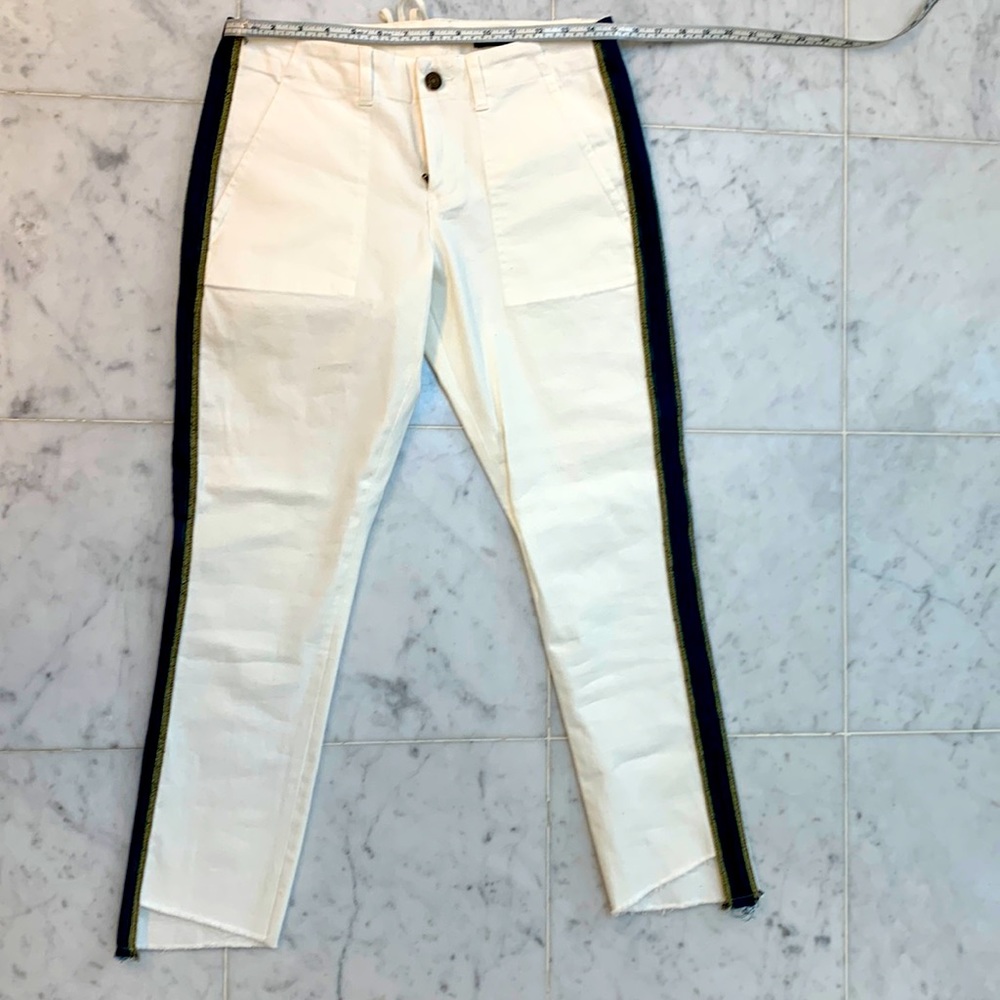 Pam & Gela ribbon embellished white jeans.